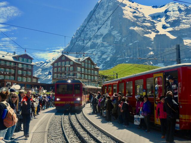 Kleine Scheidegg Station with Eiger Mountain in the background and the Hotel Bellevue des Alpes to the left of the tracks