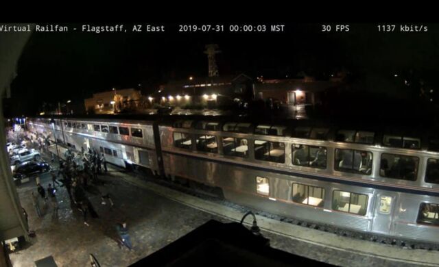 Webcam screenshot of the Southwest Chief after its arrival at Flagstaff. I can be seen with my stripy jumper and green backpack.