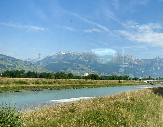 Crossing the border from Switzerland into Liechtenstein as the train travels over the River Rhine
