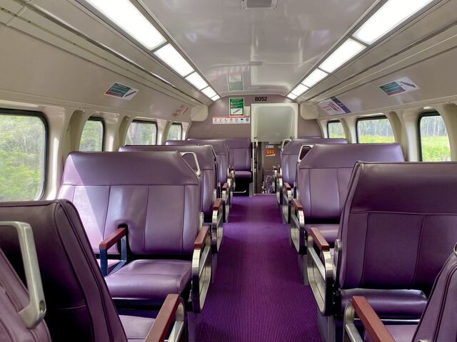 Interior of the train with its 'bush plum' carpet and seats