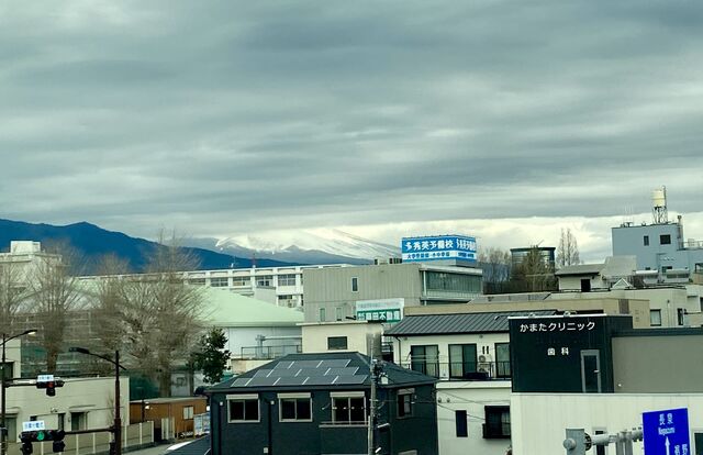 Mount Fuji behind clouds, viewed from Mishima