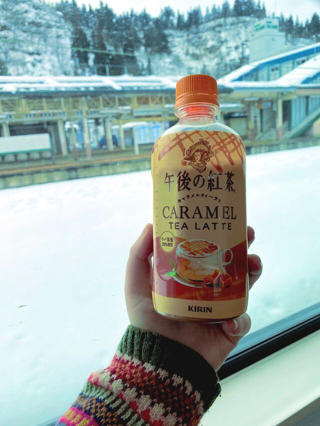 Enjoying some hot caramel tea on board the train