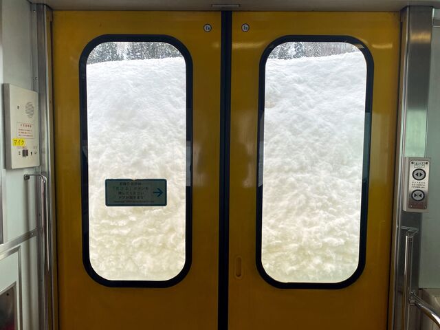 Snow piled high on the Tadami Line