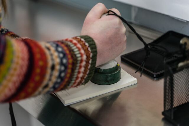 Pressing a stamp into my Eki Stamp Book